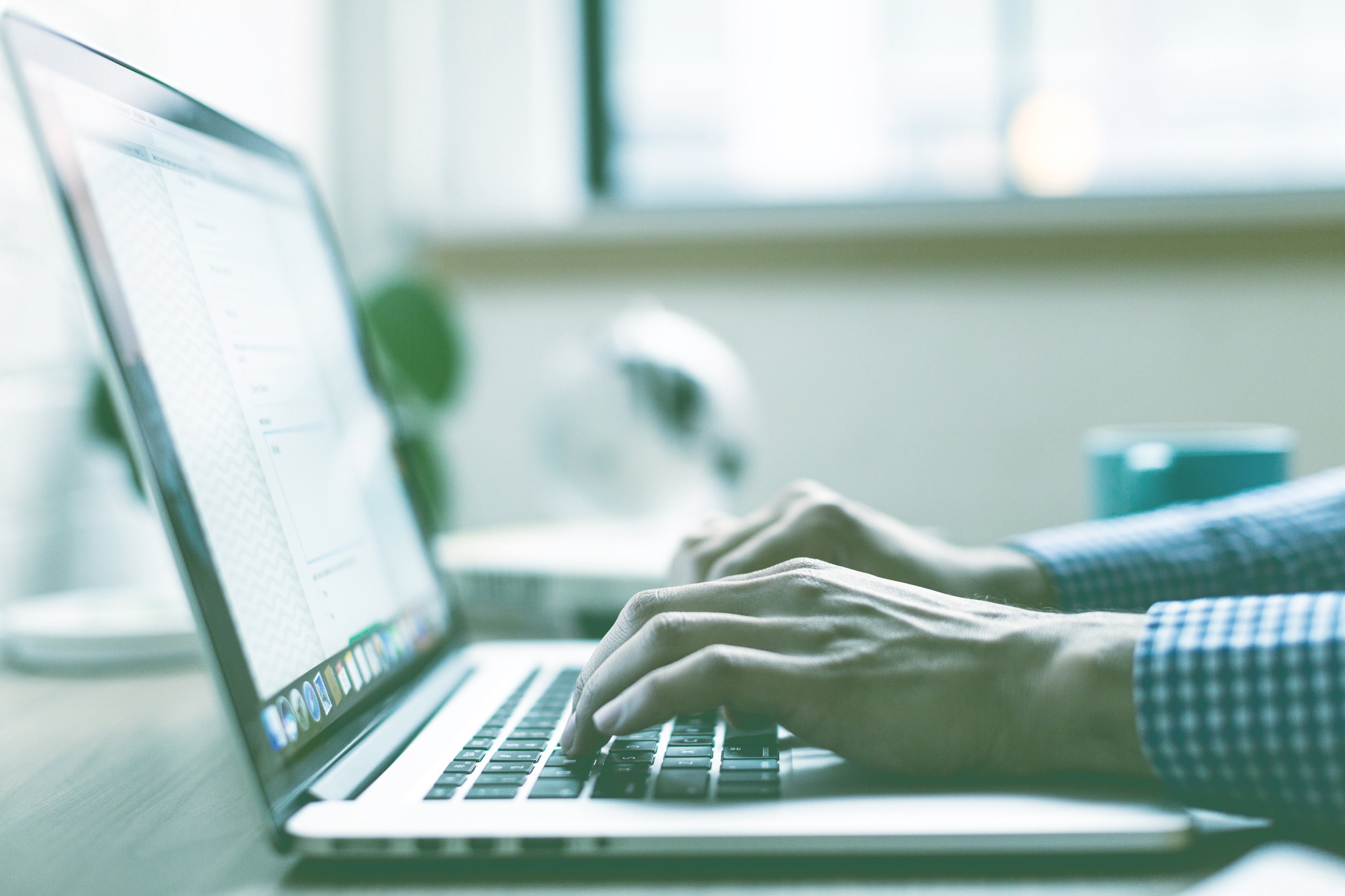 A man looking for a tax service on his laptop